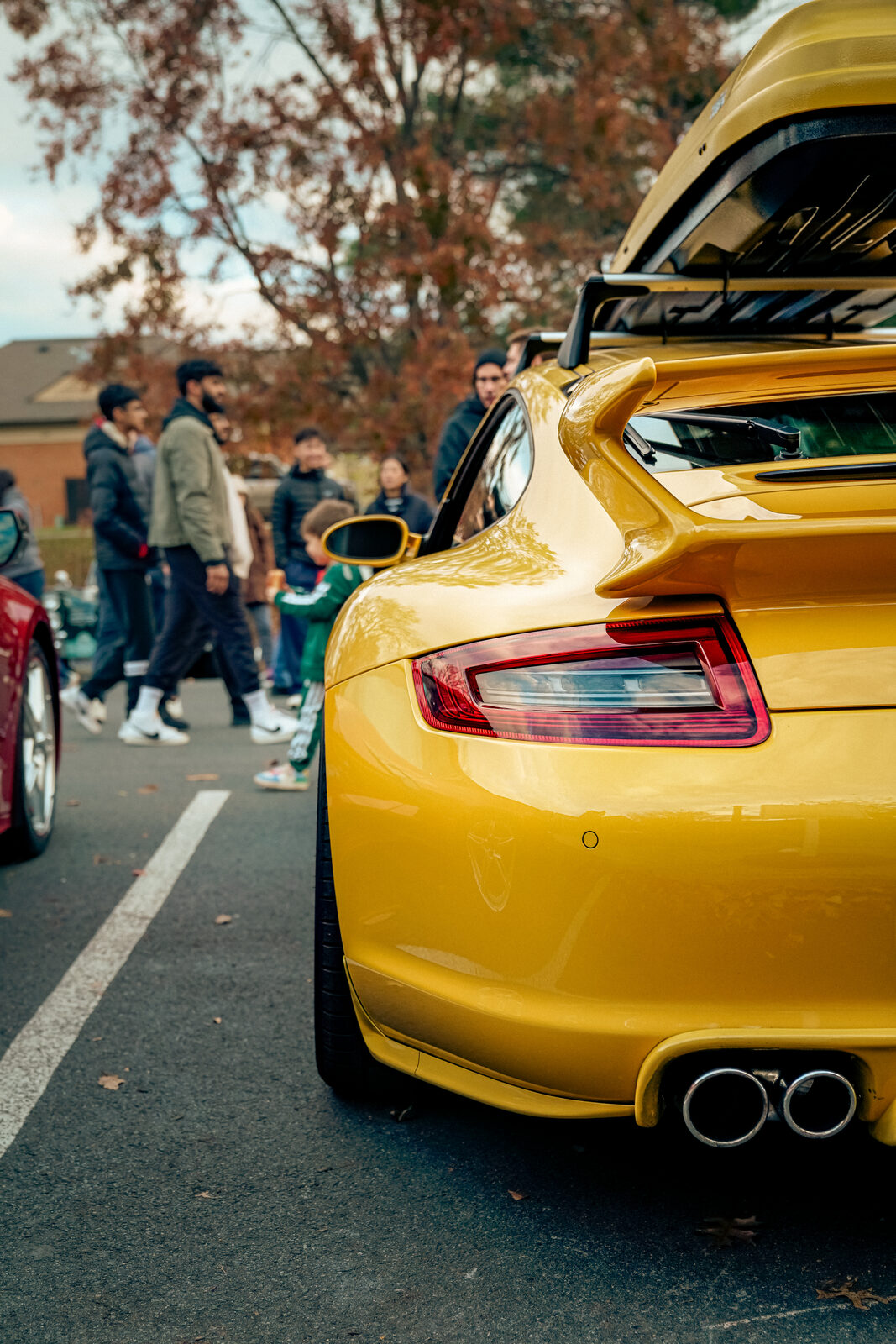 A yellow Porsche 911, rear detail shot.