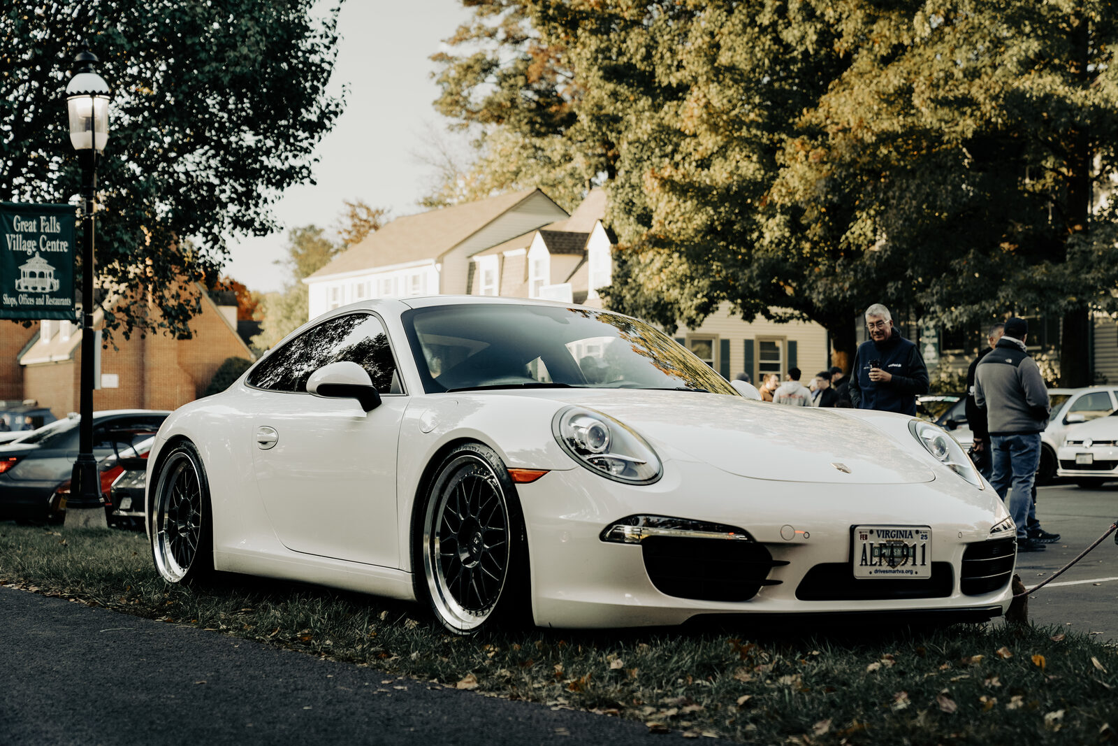 A white Porsche 911 parked at a Great Falls car meet.