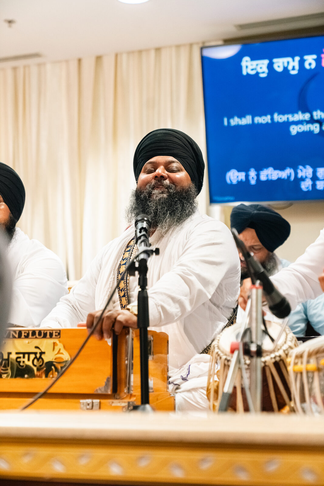 A harmonium and tabla duo performing together.