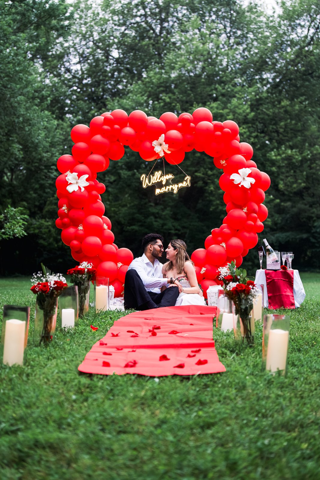 Couple celebrating after a surprise proposal.